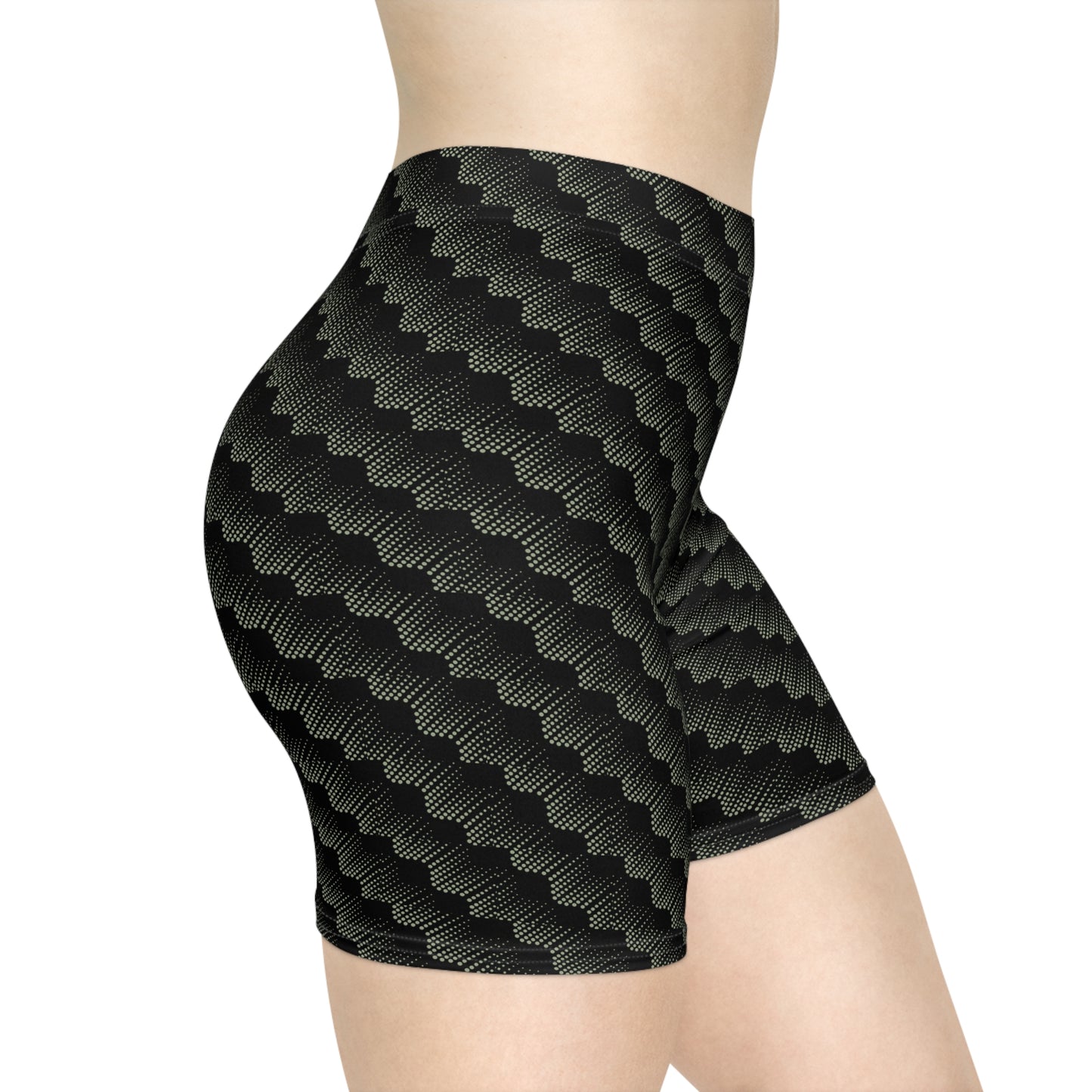 Right side view of black with abstract sage pattern athletic shorts modeled by female with white background. These biker shorts make great gifts for women who love comfortable, stylish activewear.