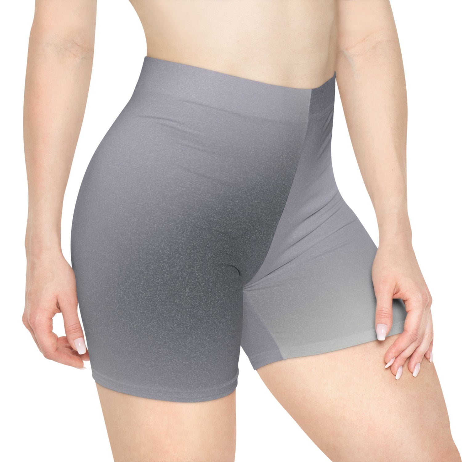 A person wearing high-waisted, gray ombre biker shorts. The shorts fit snugly, showcasing a smooth gradient from dark to light. The background is plain white. These make great gifts for women.
