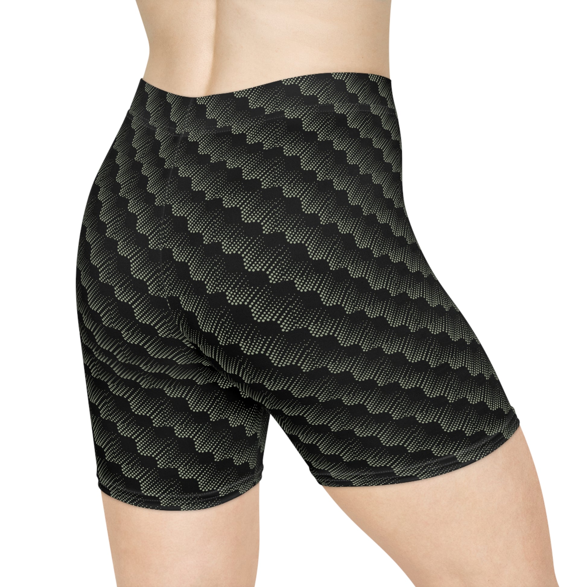 Back view of black with abstract sage pattern athletic shorts modeled by female with white background. These biker shorts make great gifts for women who love comfortable, stylish activewear.
