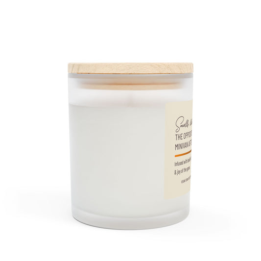 Left side view of frosted glass candle with wooden lid with small part of label visible. This funny candle makes a great gift for women.