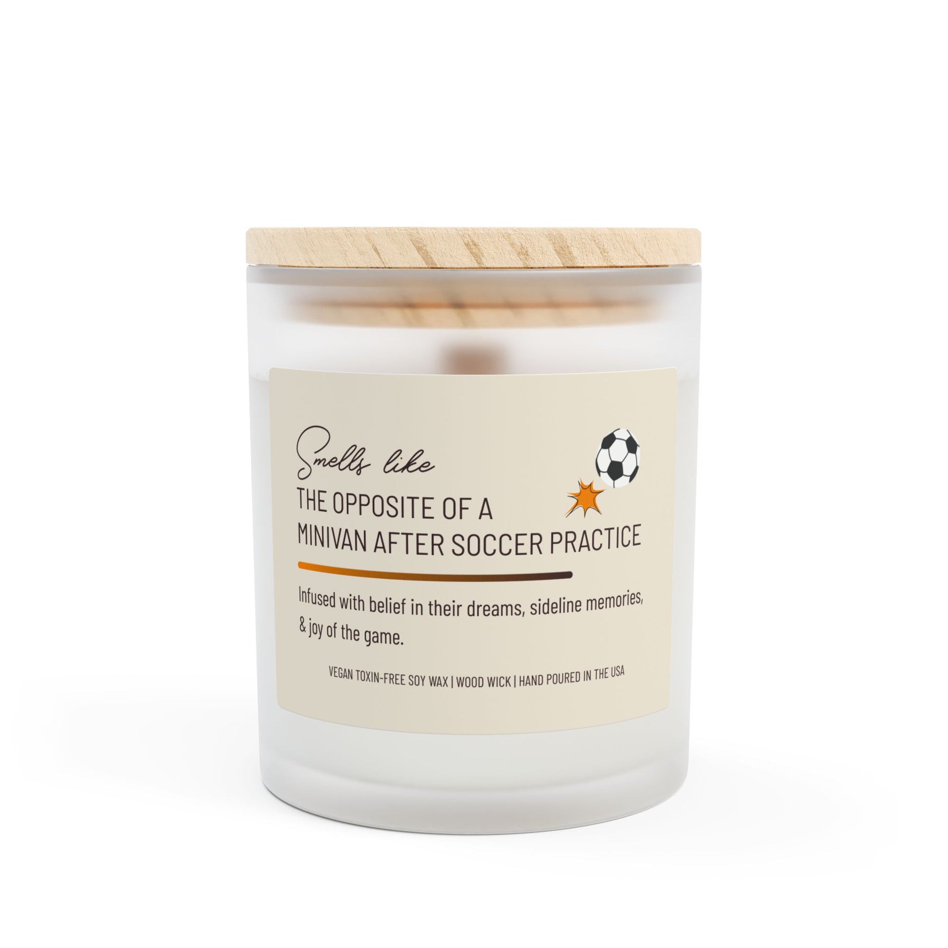 Frosted glass candle with wooden lid, labeled "Smells like the opposite of a minivan after soccer practice," featuring a small soccer ball graphic. This funny candle makes a great gift for women.