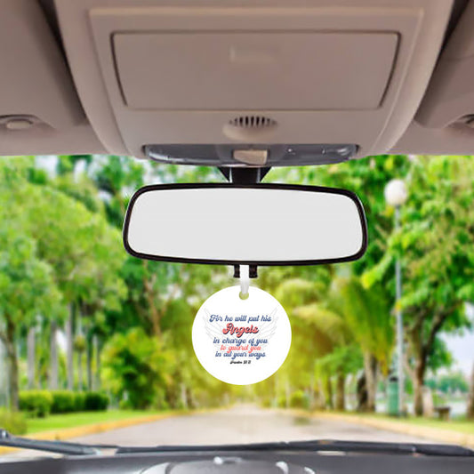 View inside vehicle of a round white car mirror hanging accessory ornament with the Bible verse Psalm 91:11, featuring angel wings. The text, in blue and red, conveys protection and guardianship. Makes a great gift for women, men, teenagers, and anyone who drives a lot in their work.